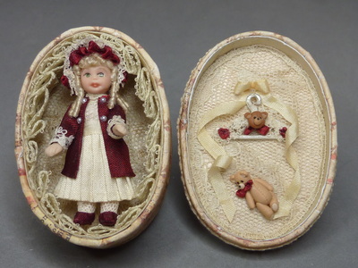 Doll in an oval box